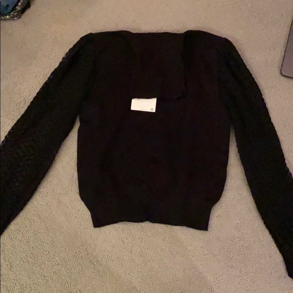 Black turtle neck with see through sleeves